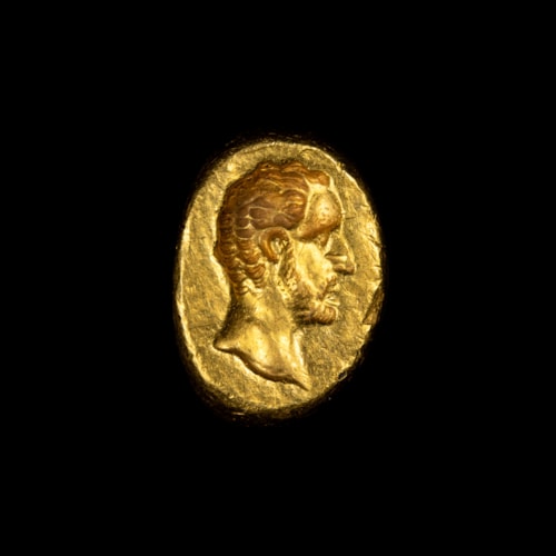 *A Roman gold engraved ring. Male portrait.
